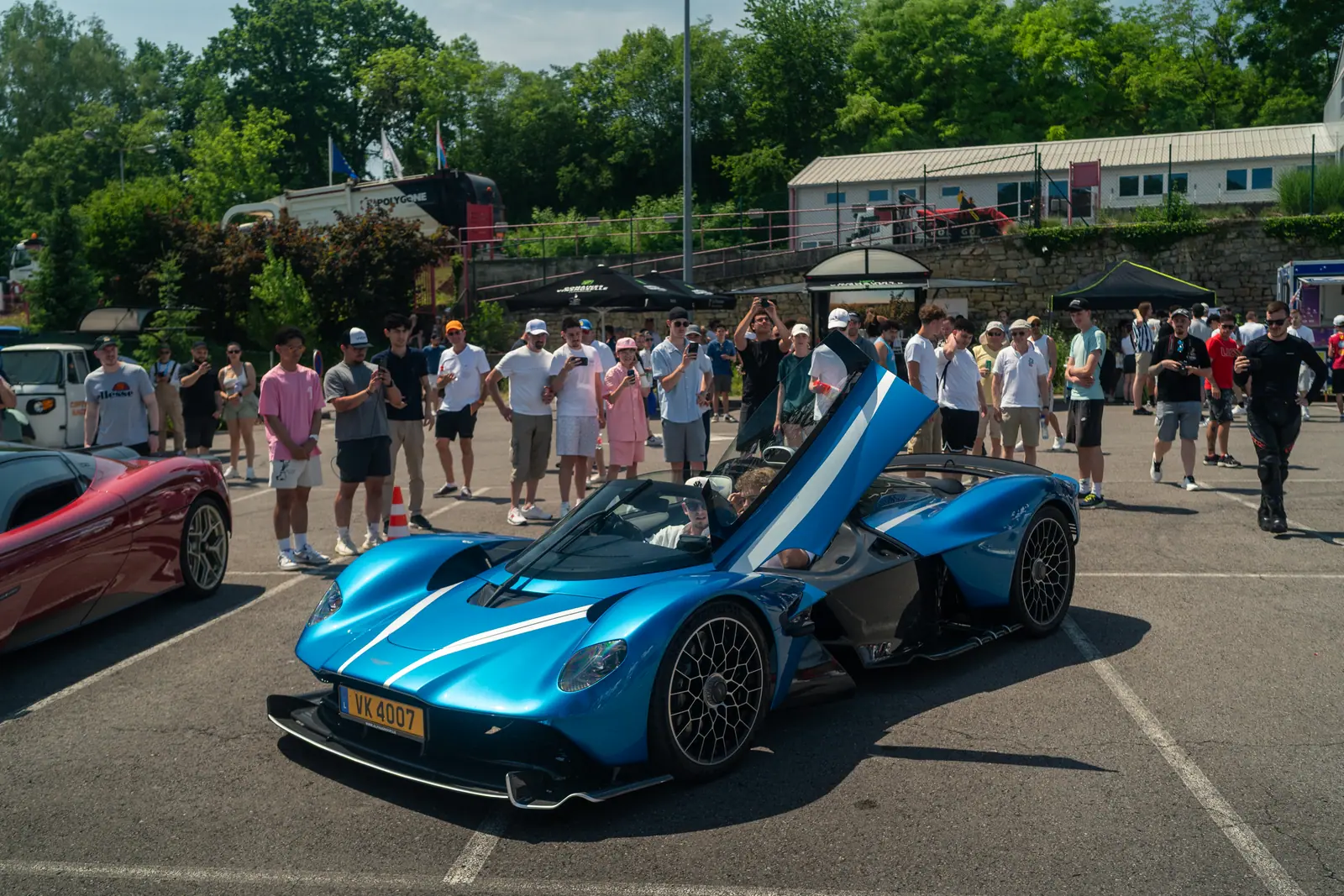 A blue supercar with its doors open at Supercar Sunday